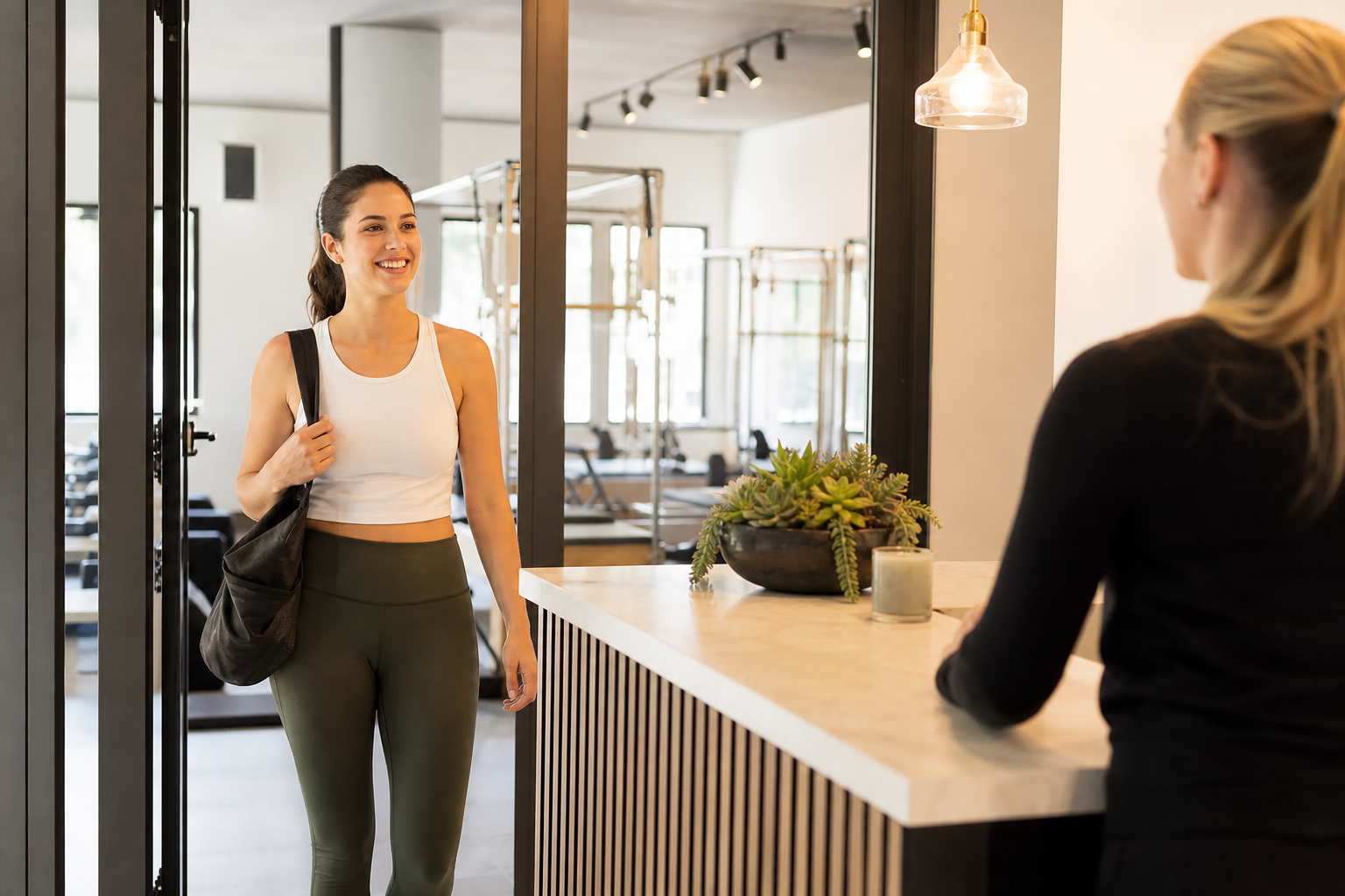 A warm and inviting photo-realistic scene of a cheerful woman entering a clean, modern pilates studi